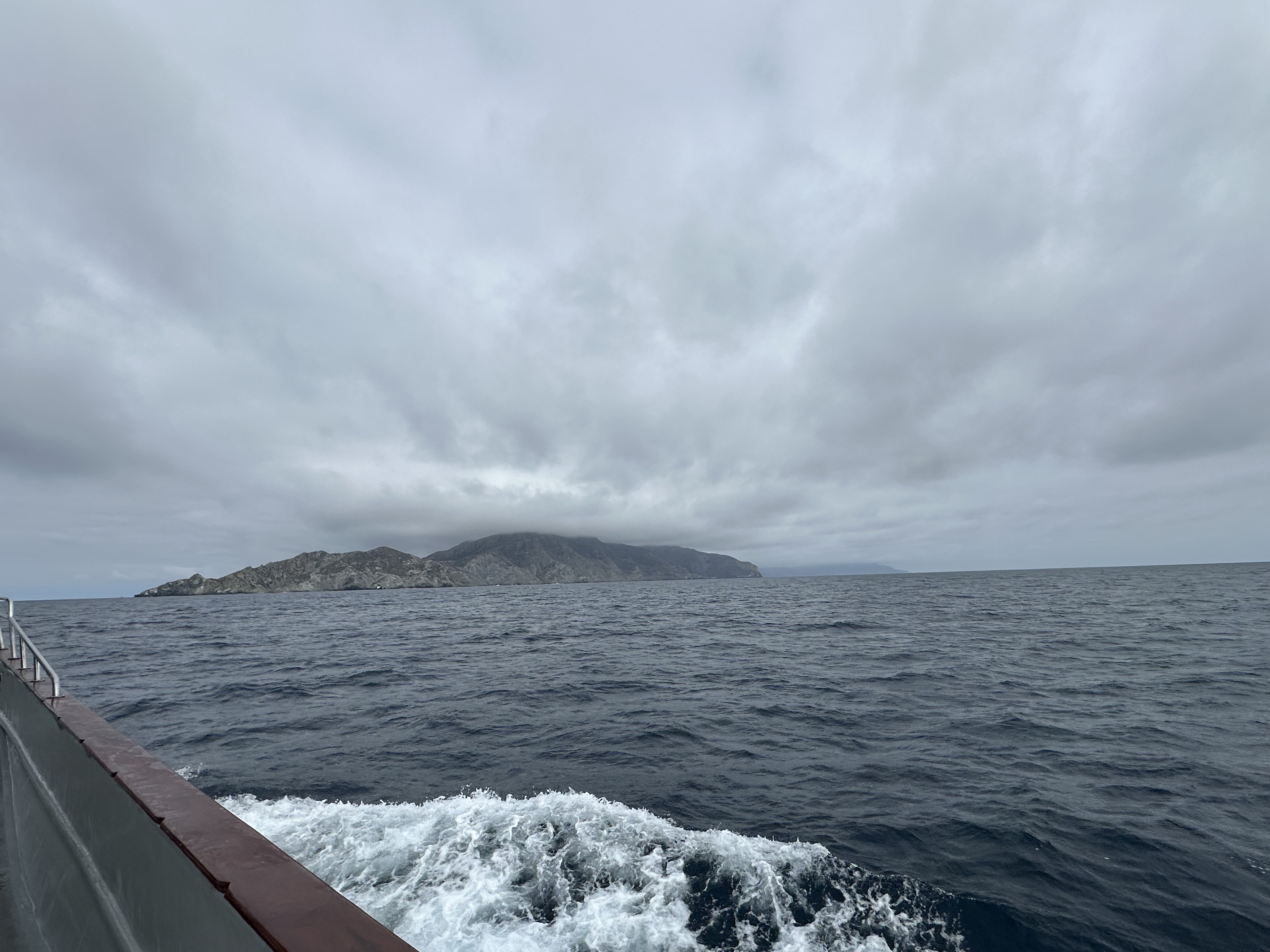 Catalina Island's rugged profile seen from a sportfishing boat under an overcast sky